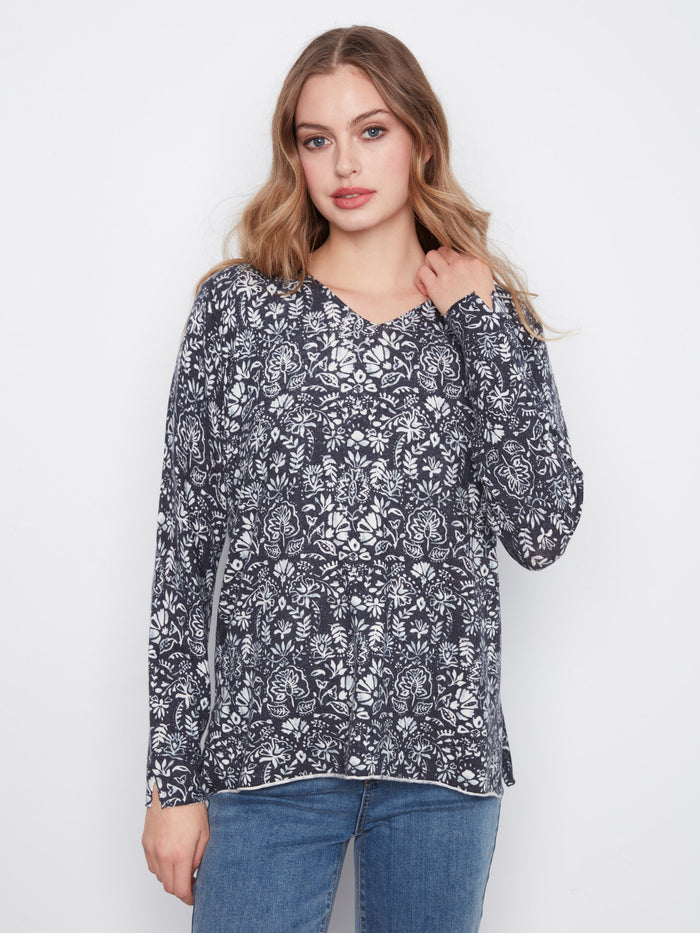 Floral top with a flattering V-neck, showcasing elegant long sleeves. Perfect for a relaxed fit look by Charlie B.