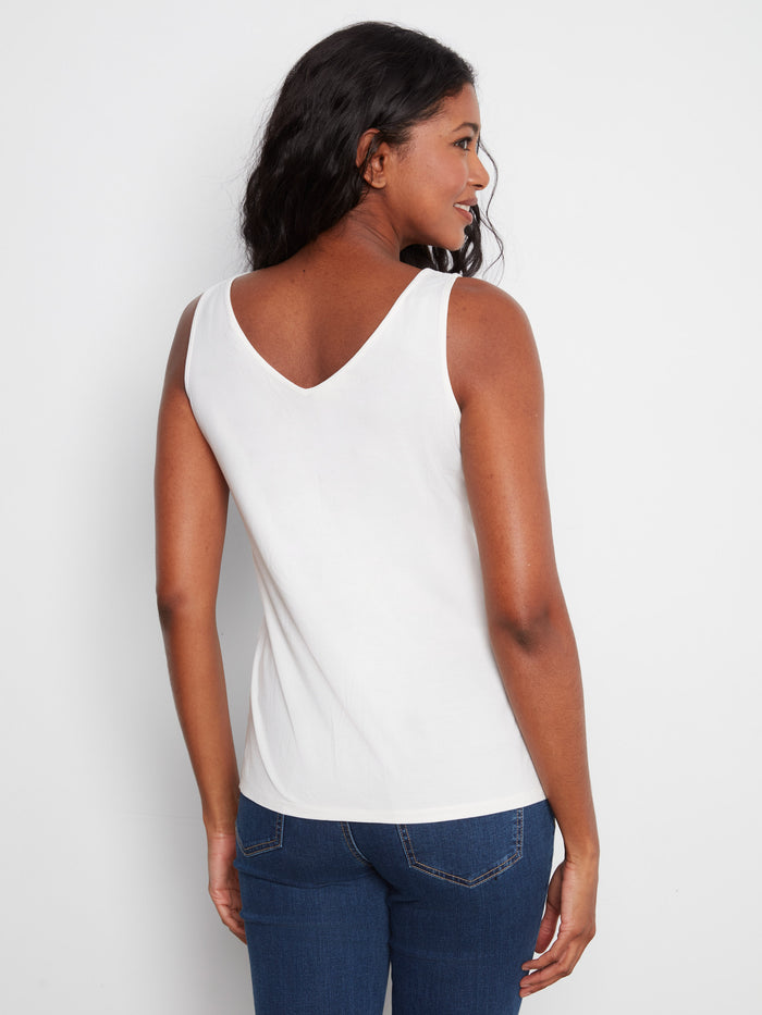 Versatile white top showcasing the reversible feature, providing style flexibility for any occasion by Charlie B.