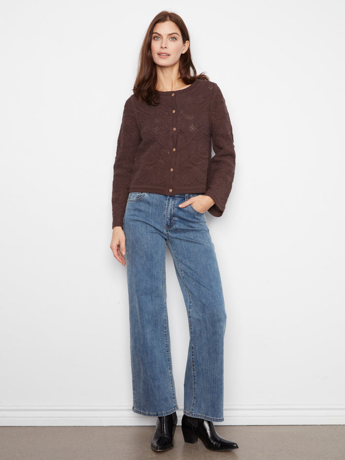 The button-down front or back adds a unique touch to this chic sweater, elevating any outfit. Designed by Charlie B.