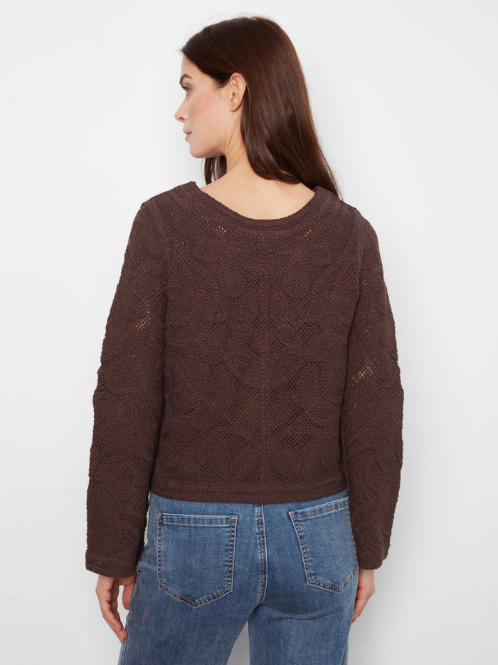 Crafted from 100% cotton, this sweater offers both comfort and breathability for everyday wear. Styled by Charlie B.