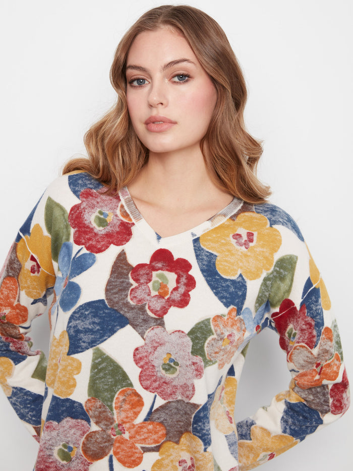 Crafted from a cozy cotton blend, this floral sweater ensures softness and breathability. A perfect addition to your collection by Charlie B.