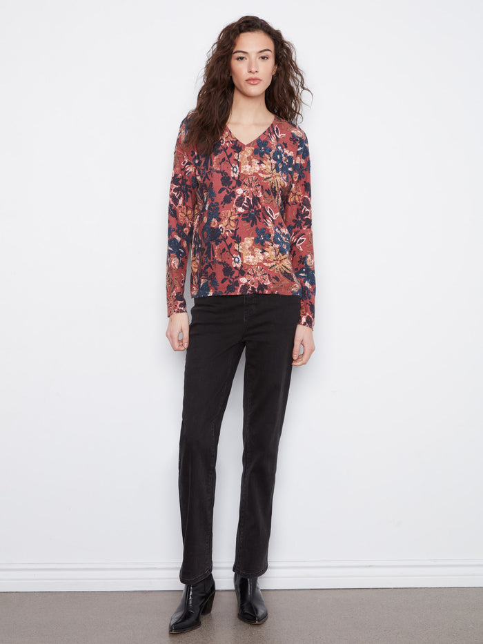 Stylish long-sleeve top with intricate floral design, ideal for layering in cooler weather. Cotton blend fabric ensures comfort by Charlie B.