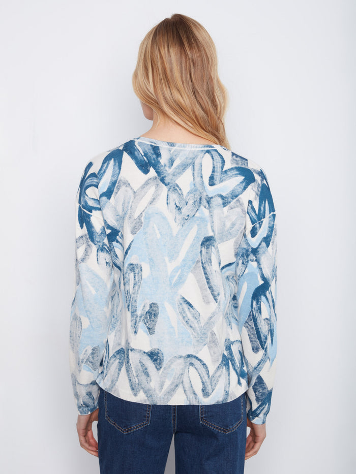 The unique pattern adds flair to this comfortable and chic cotton blend top. Perfect for any season! By Charlie B.