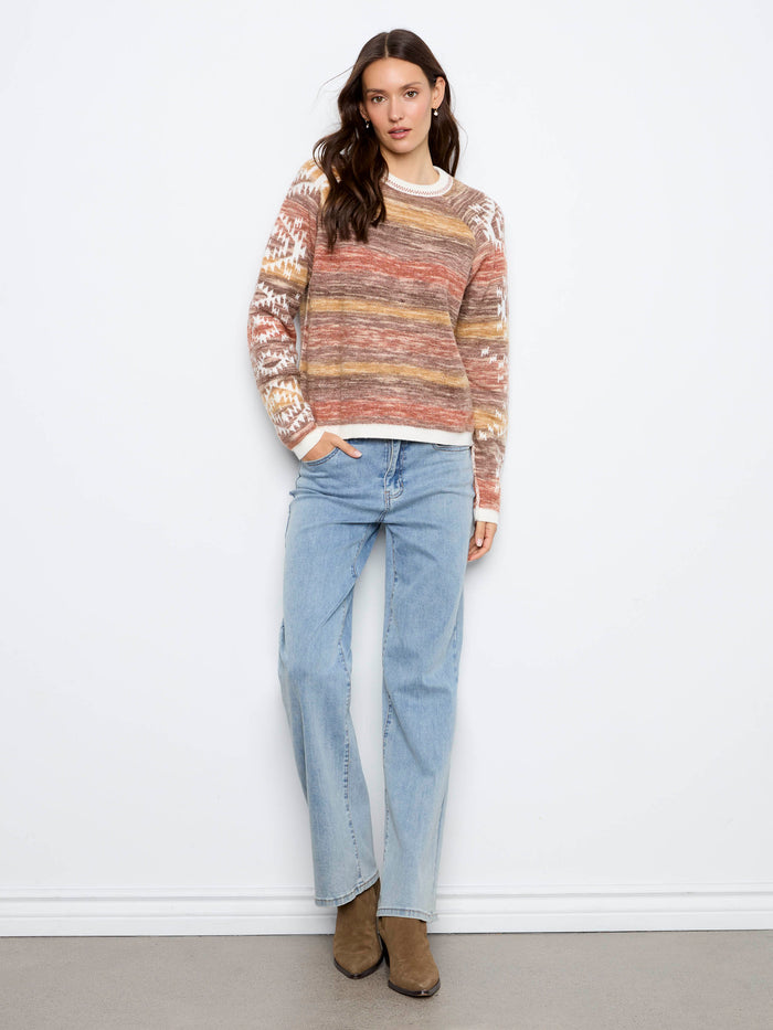 Crafted with double-layer knit, this sweater ensures warmth and comfort throughout the day. By Charlie B.