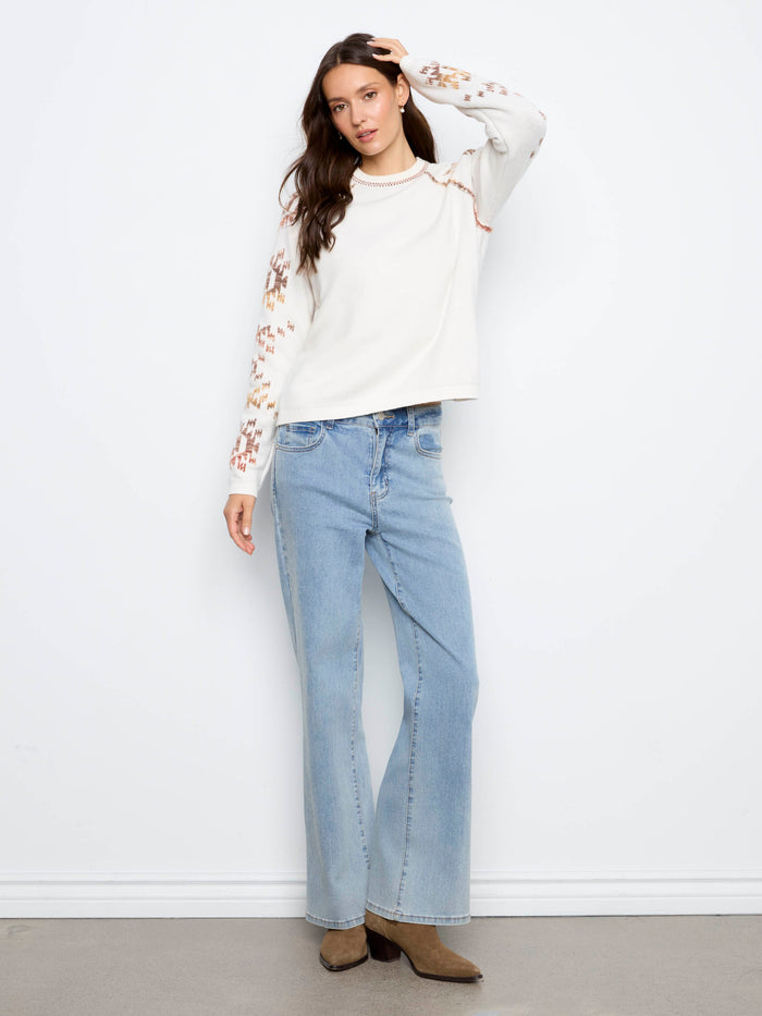 The raglan sleeves provide a relaxed fit and enhance the casual elegance of this knitwear. By Charlie B.