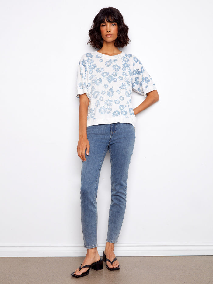Enjoy the soft, breathable feel of this 100% cotton floral top, ideal for any season and easy to pair with jeans. By Charlie B.