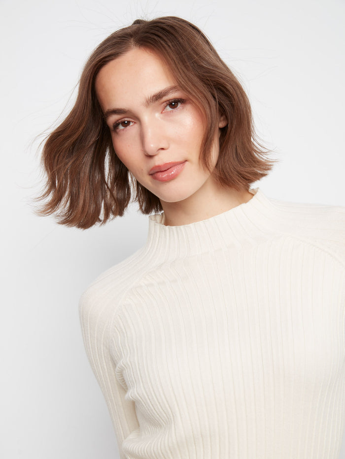 Long sleeves add to the cozy appeal of this versatile sweater by Charlie B.