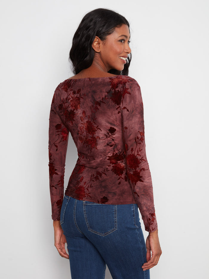 This beautiful garment features long sleeves and an exquisite design, making it ideal for layering or wearing alone by Charlie B.