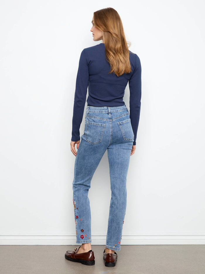 Denim jeans featuring a comfortable stretch fabric and charming floral details at the hem by Charlie B.