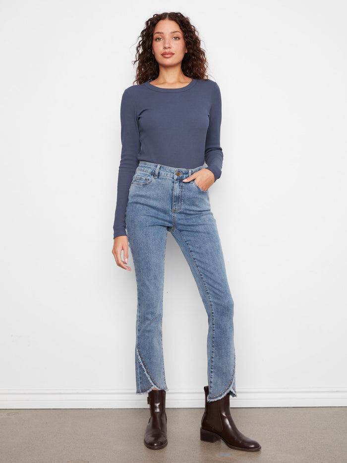 These jeans feature a slim fit design, perfect for a sleek and modern look. Crafted with attention to detail by Charlie B.