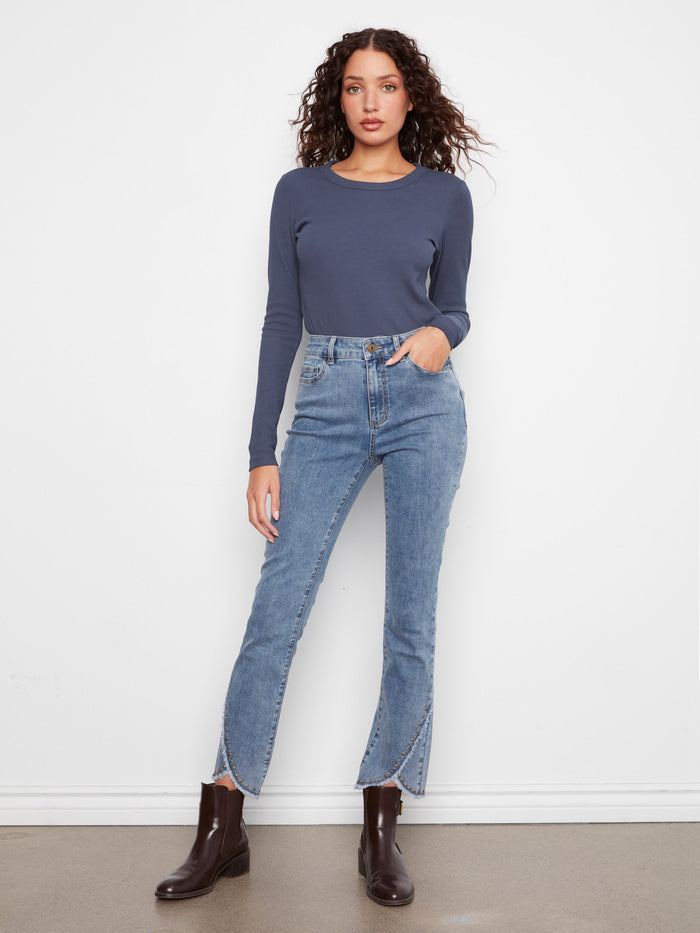 These full-length jeans provide coverage while maintaining a fashionable edge in your wardrobe. Styled uniquely by Charlie B.