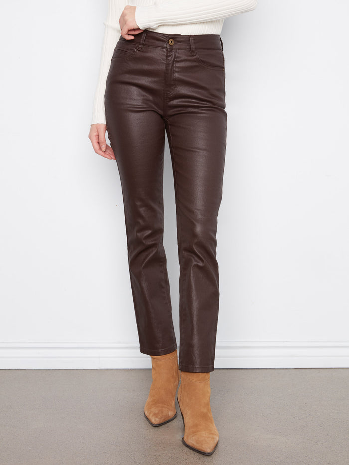 Stretch twill fabric in coffee color pants paired elegantly with a white top and boots by Charlie B.