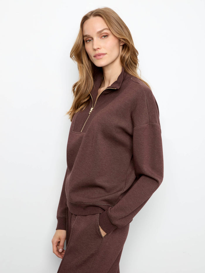 Long sleeves offer warmth and comfort in this trendy apparel by Charlie B.