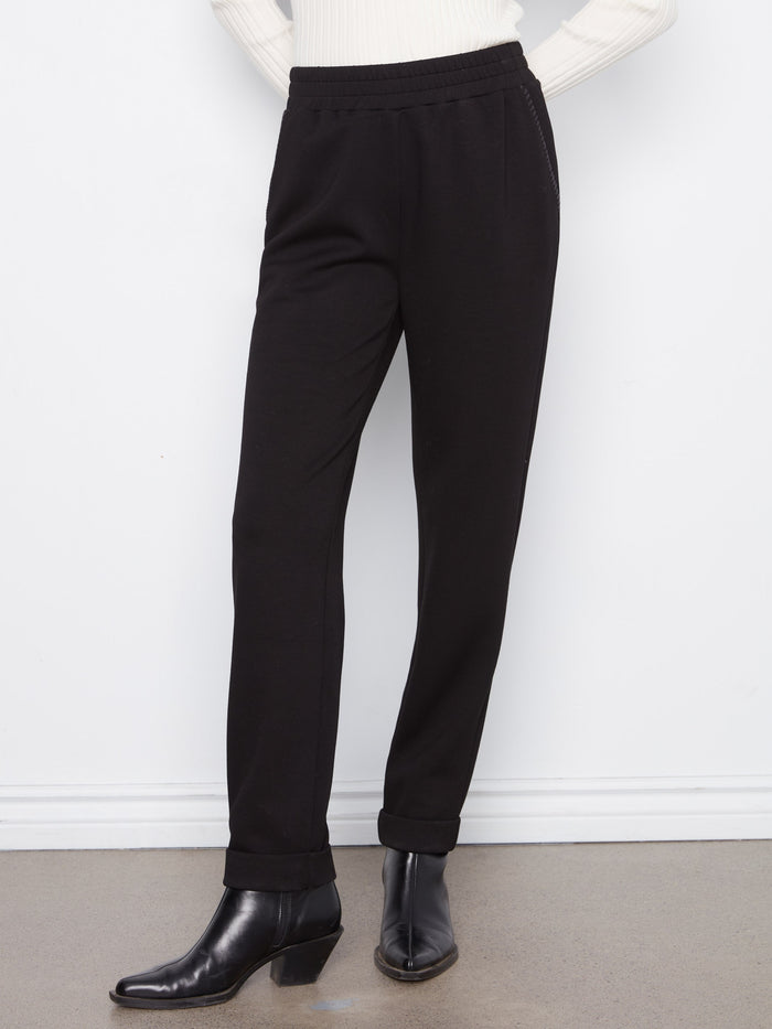 Crafted from stretch fabric, these pants provide comfort and flexibility for all-day wear by Charlie B.