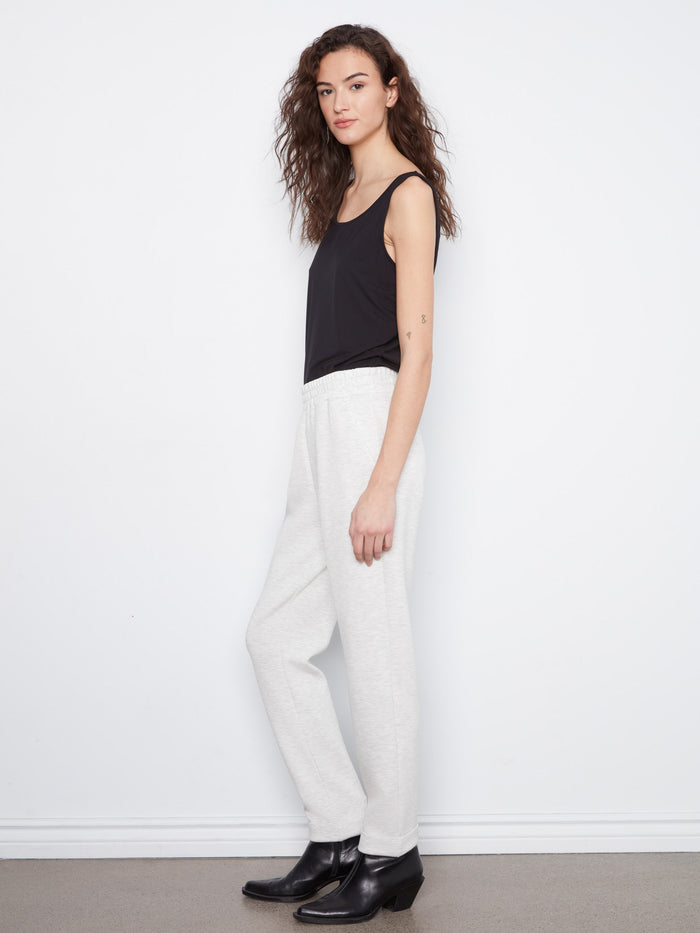 The slim leg design of these heather-light grey joggers combines modern aesthetics with practical functionality by Charlie B.