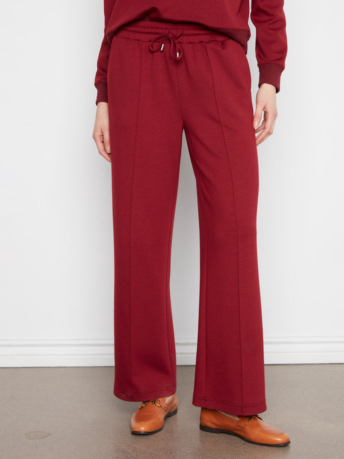 Full-length pants with an elastic waistband and drawstring for adjustable comfort. Ideal for casual or semi-formal wear by Charlie B.