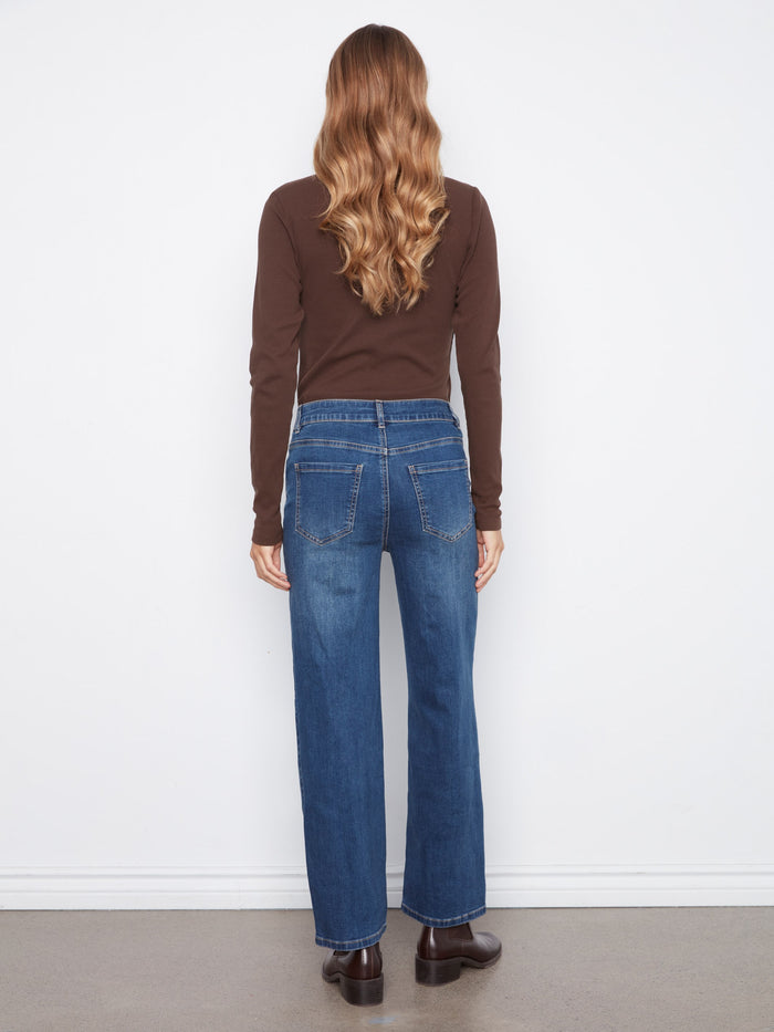 Classic five-pocket design enhances these stylish denim jeans with playful heart patch details. By Charlie B.