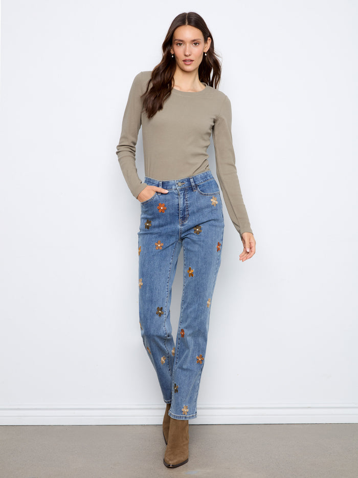 Designed with a regular rise, these jeans offer classic appeal while enhancing your silhouette beautifully. Fashion by Charlie B.