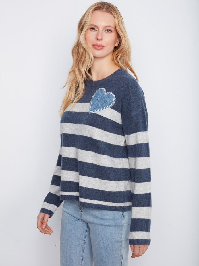 Heather denim sweater with stylish stripes and heart embroidery, offering a relaxed fit by Charlie B.