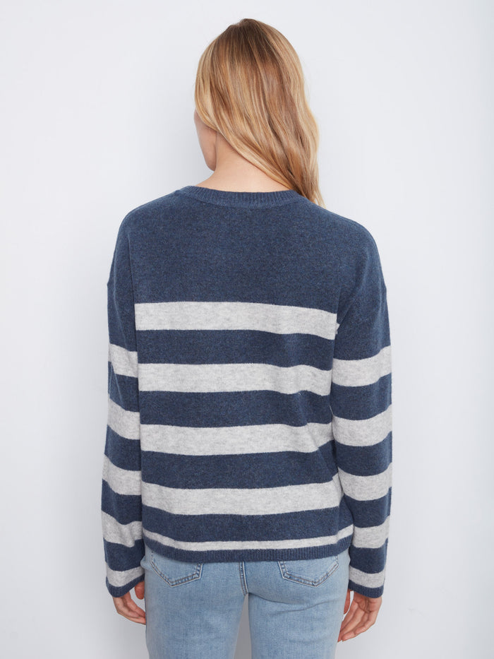 Casual striped sweater highlighted by its unique heart patch embroidery and comfortable design by Charlie B.