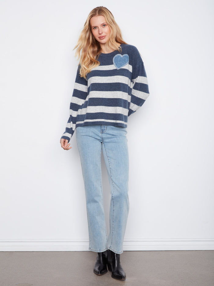 Comfortable heather denim sweater with long sleeves and an eye-catching heart detail for everyday wear by Charlie B.