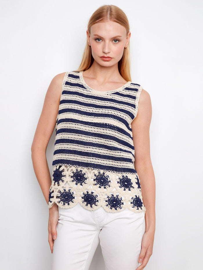 Navy and cream crochet top with a crew neckline, featuring intricate floral hem detailing for a chic look by Charlie B.