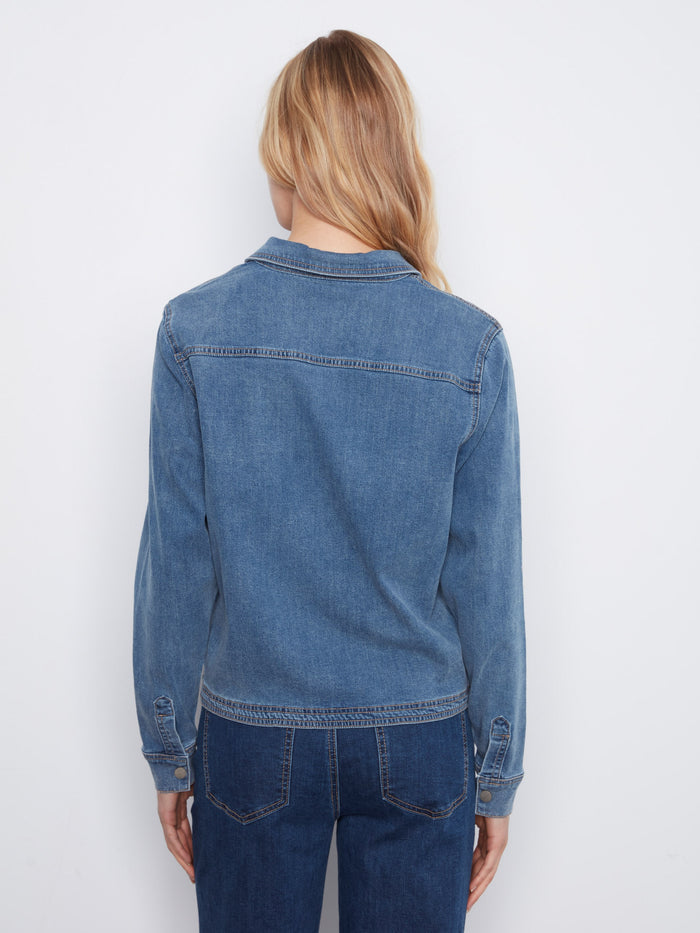 The half snap-button closure on this denim shirt adds a modern touch to its timeless design. Experience the comfort of Tencel by Charlie B.
