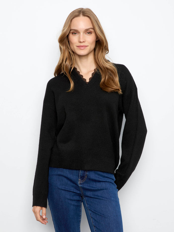 Sweater with V-notch neckline featuring leopard print trim adds a chic touch to any outfit by Charlie B.