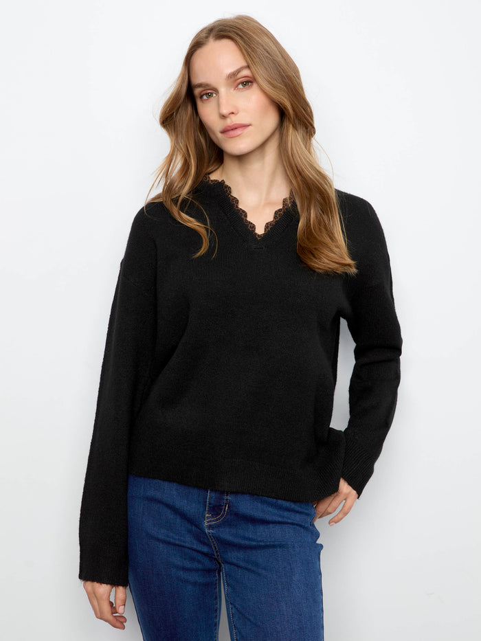 Long sleeves provide warmth and versatility, making this sweater a staple piece for your wardrobe by Charlie B.