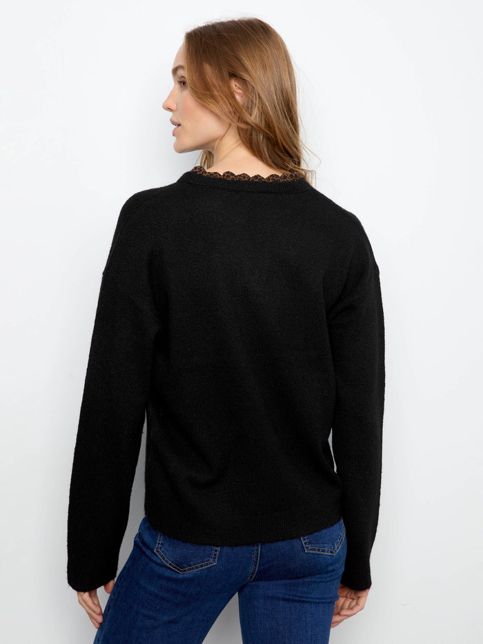 Back view highlighting the seamless drop shoulder design and soft texture of this stylish sweater. By Charlie B.