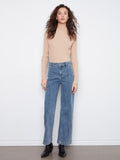 These jeans feature an extra-wide leg design, offering a trendy and comfortable fit by Charlie B.