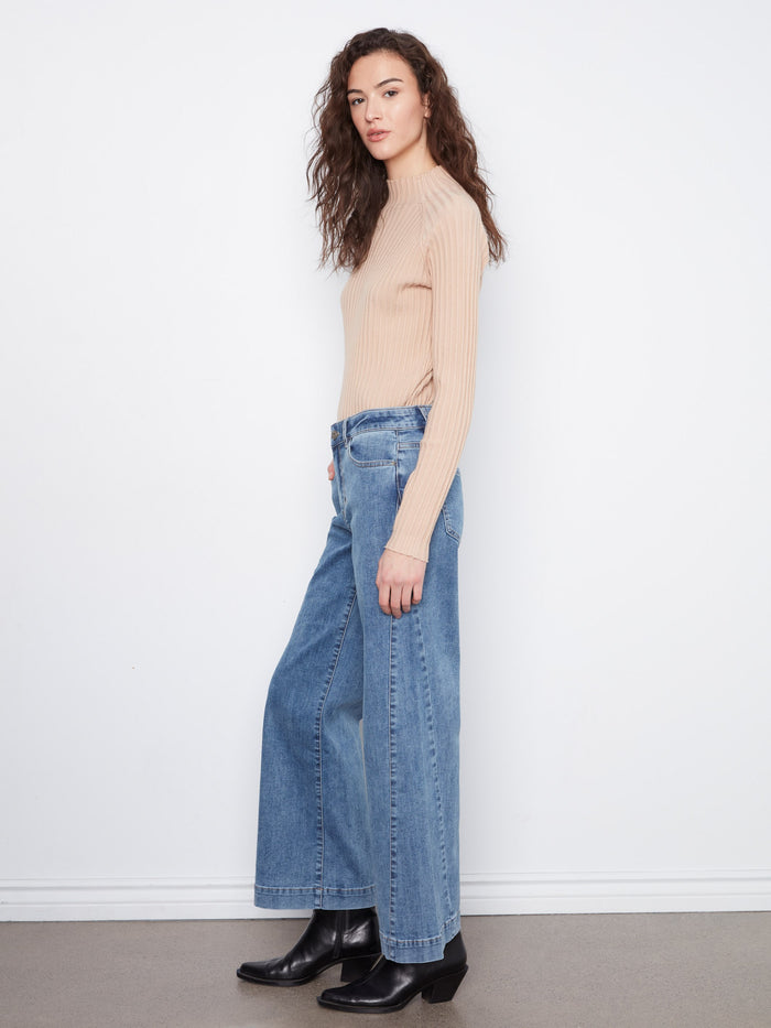Featuring stylish side panel details, these jeans add flair to any outfit by Charlie B.